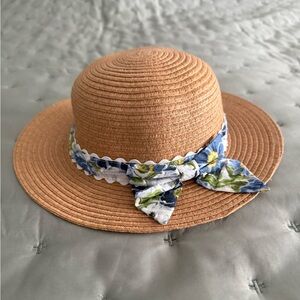 Little girl’s straw hat with blue floral print ribbon & bow. How cute is this!